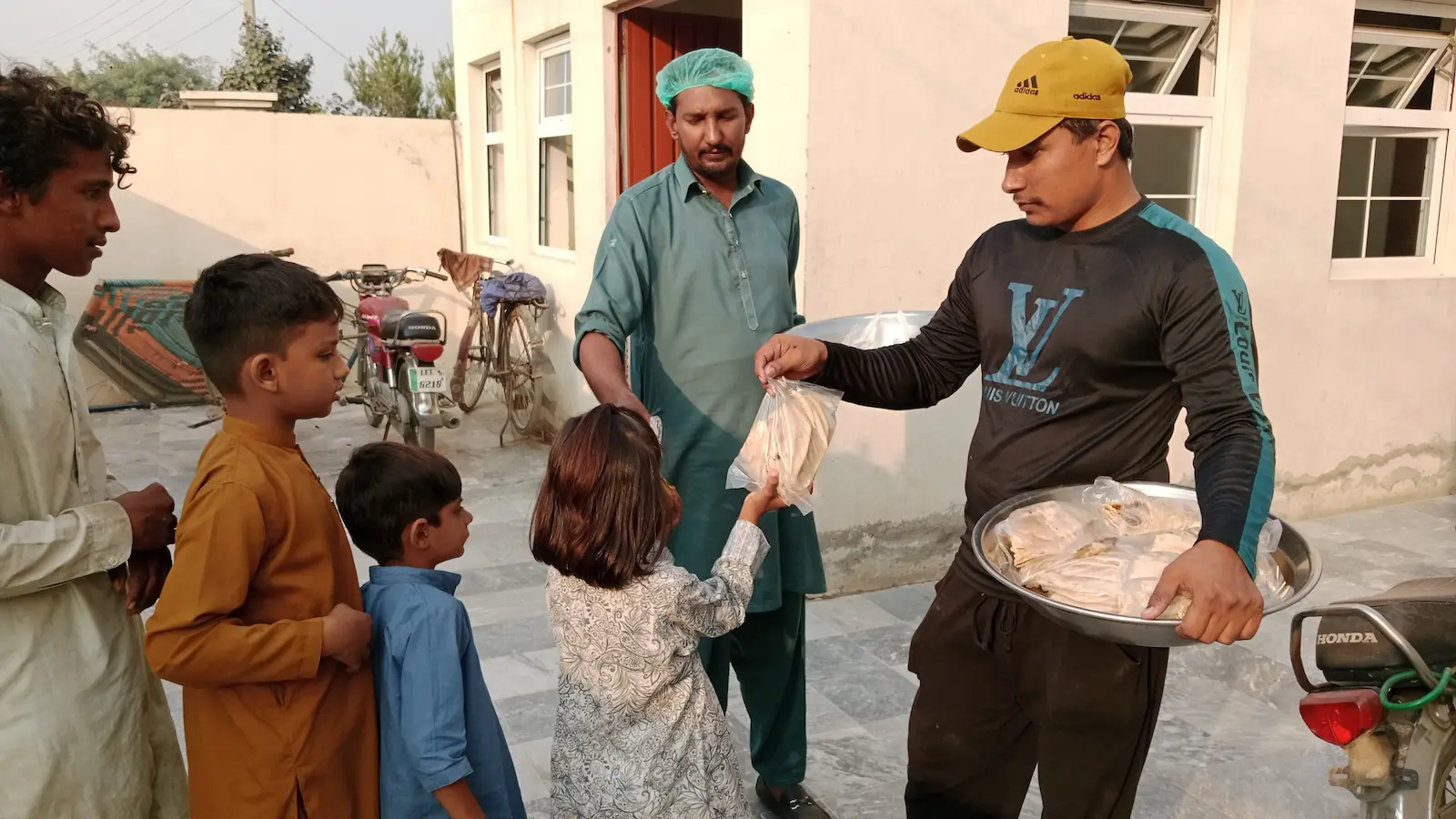 People completing a surplus food handoff in the community.