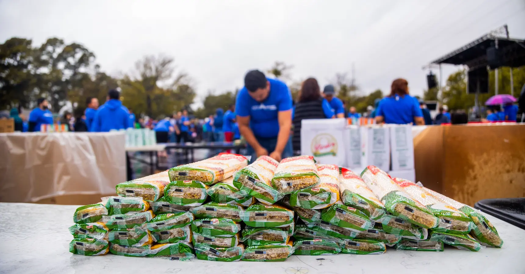 Surplus food being prepared and packed for donation.